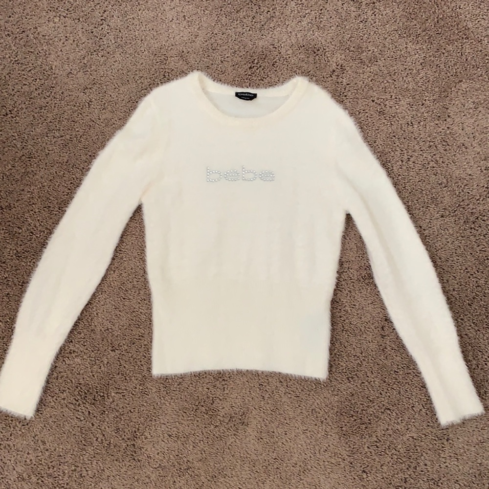 Bebe sweater, medium size, cream fuzzy material.